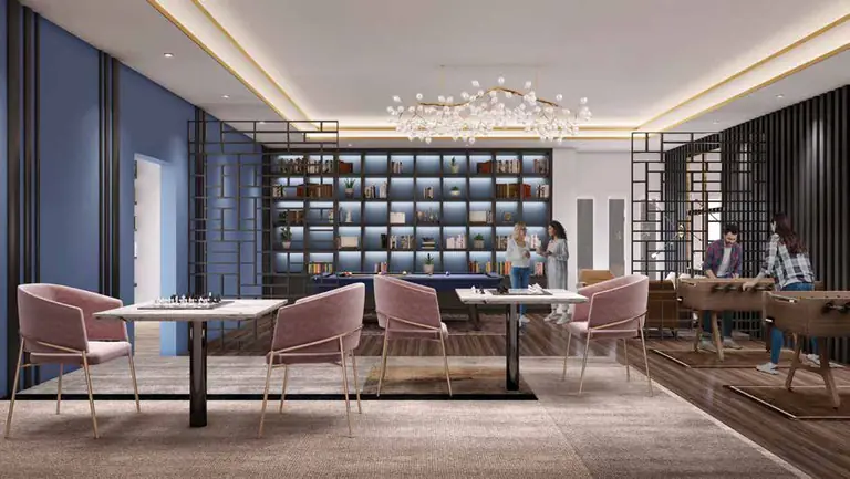 Co-working desks and mini library in the clubhouse at Dosti Greenscapes, Hadapsar, Pune