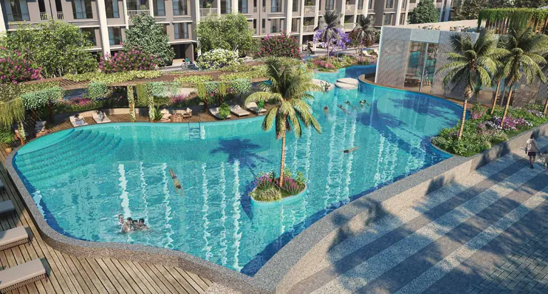 Lap pool with planted island and timber deck at Dosti Greenscapes