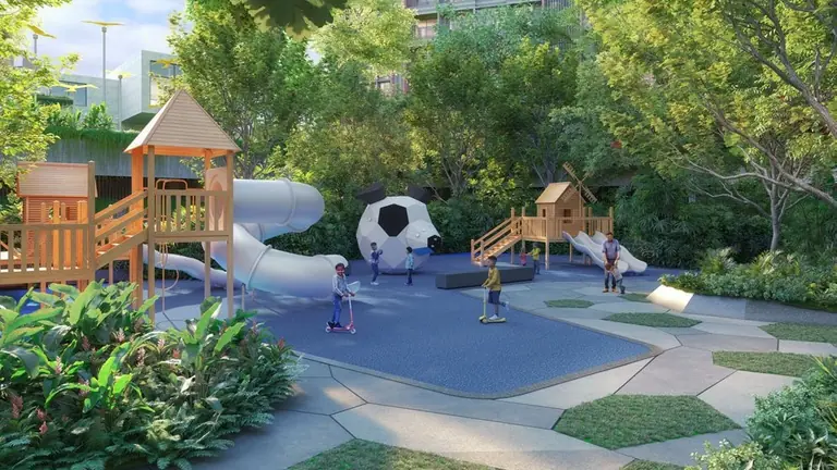 The kids' play area with treehouse, slides and soft surfacing at Yashada EVO, Punawale